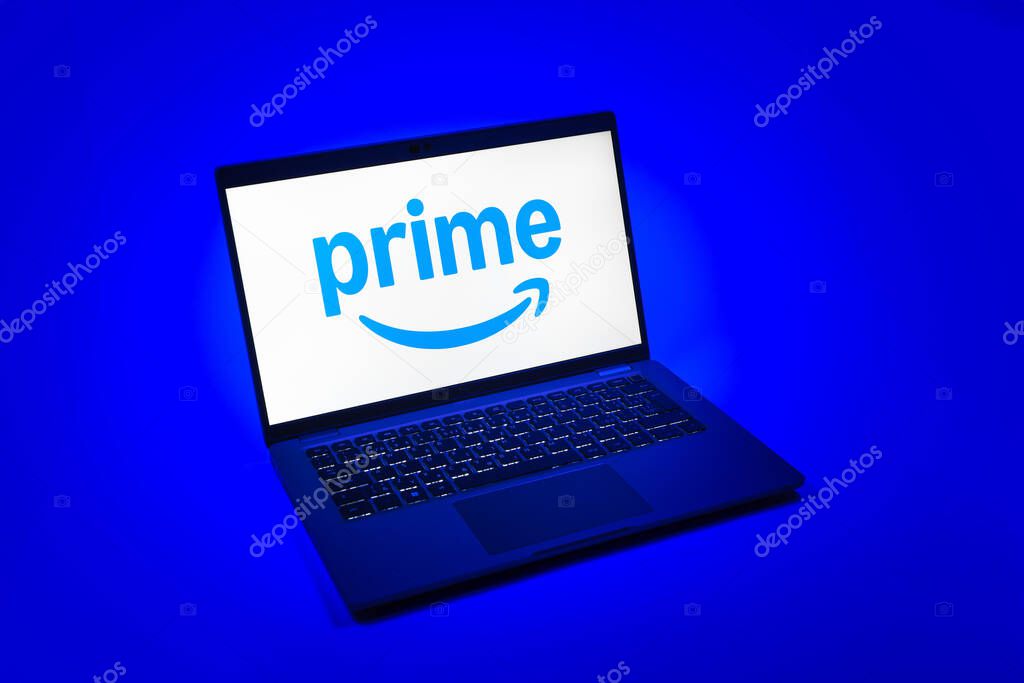 Prague, Czechia - 08 12 2025: A top-down view of a laptop on a uniform background displaying the Prime logo. Prime is a subscription service for shopping, streaming, and benefits.