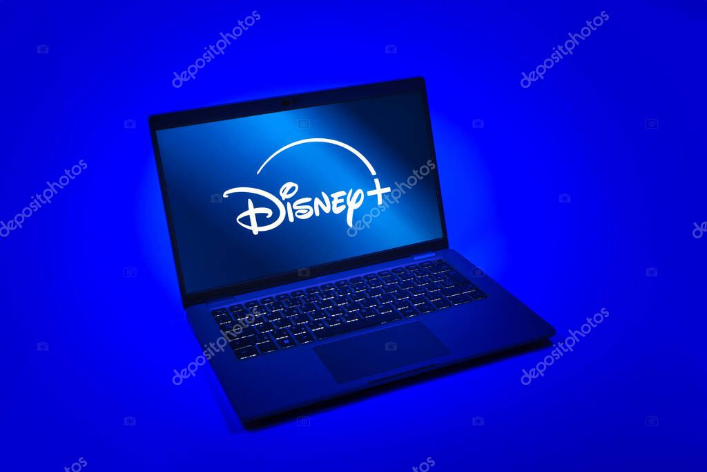 Prague, Czechia - 08 12 2025: A top-down view of a laptop on a uniform background displaying the Disney+ logo. Disney + is a streaming platform for movies and TV shows.