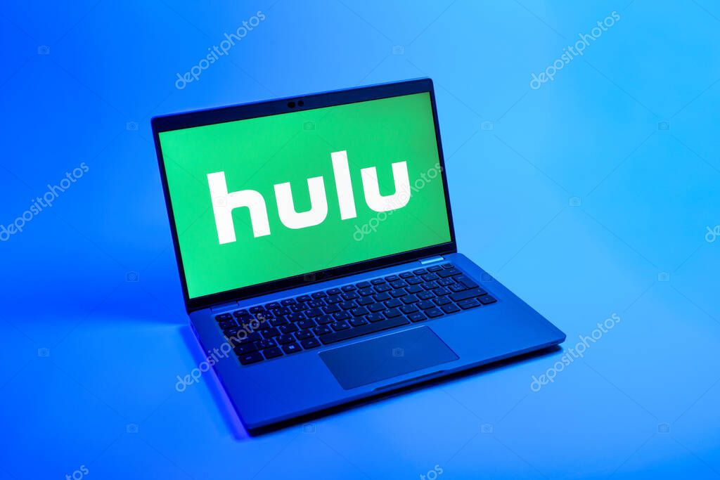 Prague, Czechia - 08 12 2025: A top-down view of a laptop on a uniform background displaying the Hulu logo. Hulu is a streaming platform for TV shows, movies, and live TV.