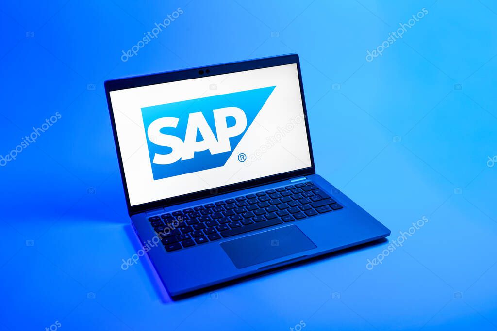 Prague, Czechia - 08 12 2025: A top-down view of a laptop on a uniform background displaying the SAP logo. SAP is a software company providing enterprise applications and solutions.