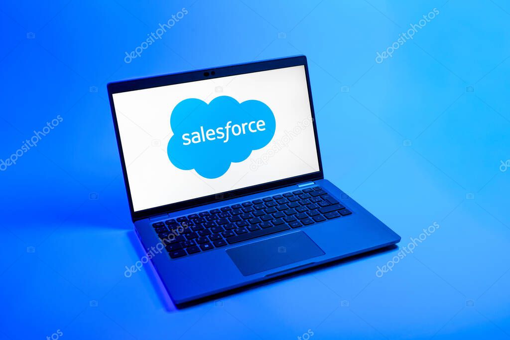 Prague, Czechia - 08 12 2025: A top-down view of a laptop on a uniform background displaying the Salesforce logo. Salesforce is a platform for customer relationship management and cloud services.