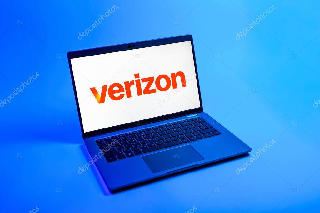 Prague, Czechia - 08 12 2025: A top-down view of a laptop on a uniform background displaying the Verizon logo. Verizon is a telecom company providing wireless and broadband services.