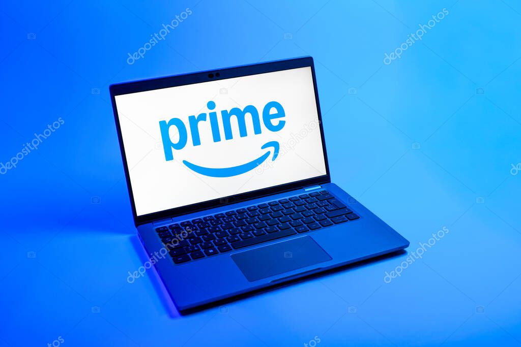 Prague, Czechia - 08 12 2025: A top-down view of a laptop on a uniform background displaying the Prime logo. Prime is a subscription service for shopping, streaming, and benefits.