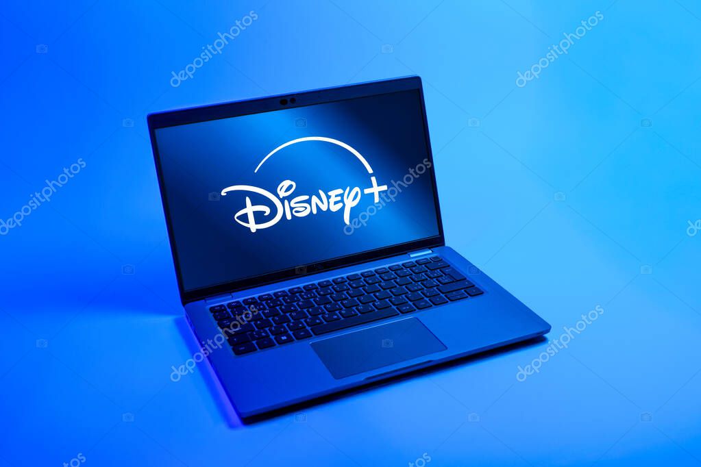 Prague, Czechia - 08 12 2025: A top-down view of a laptop on a uniform background displaying the Disney+ logo. Disney + is a streaming platform for movies and TV shows.