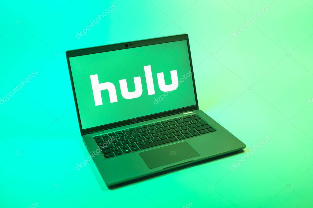 Prague, Czechia - 08 12 2025: A top-down view of a laptop on a uniform background displaying the Hulu logo. Hulu is a streaming platform for TV shows, movies, and live TV.