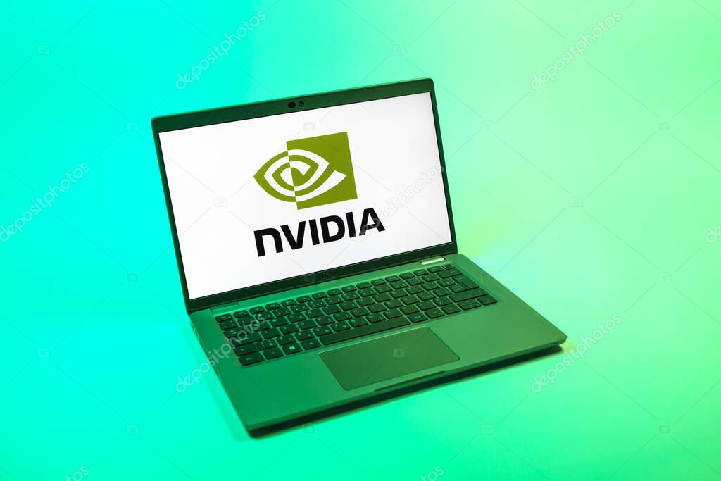 Prague, Czechia - 08 12 2025: A top-down view of a laptop on a uniform background displaying the NVIDIA logo. NVIDIA is a technology company specializing in GPUs and AI hardware.