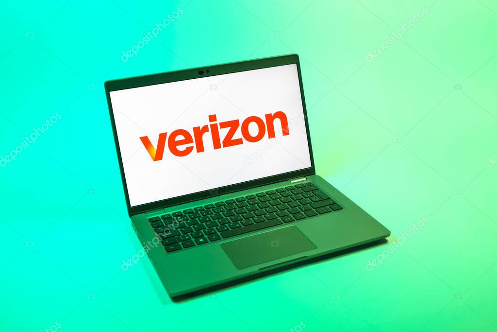 Prague, Czechia - 08 12 2025: A top-down view of a laptop on a uniform background displaying the Verizon logo. Verizon is a telecom company providing wireless and broadband services.