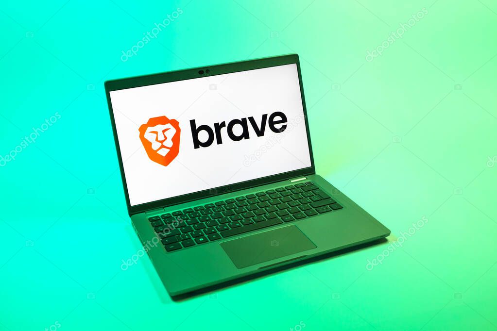 Prague, Czechia - 08 12 2025: A top-down view of a laptop on a uniform background displaying the Brave logo. Brave is a web browser focused on privacy and speed.