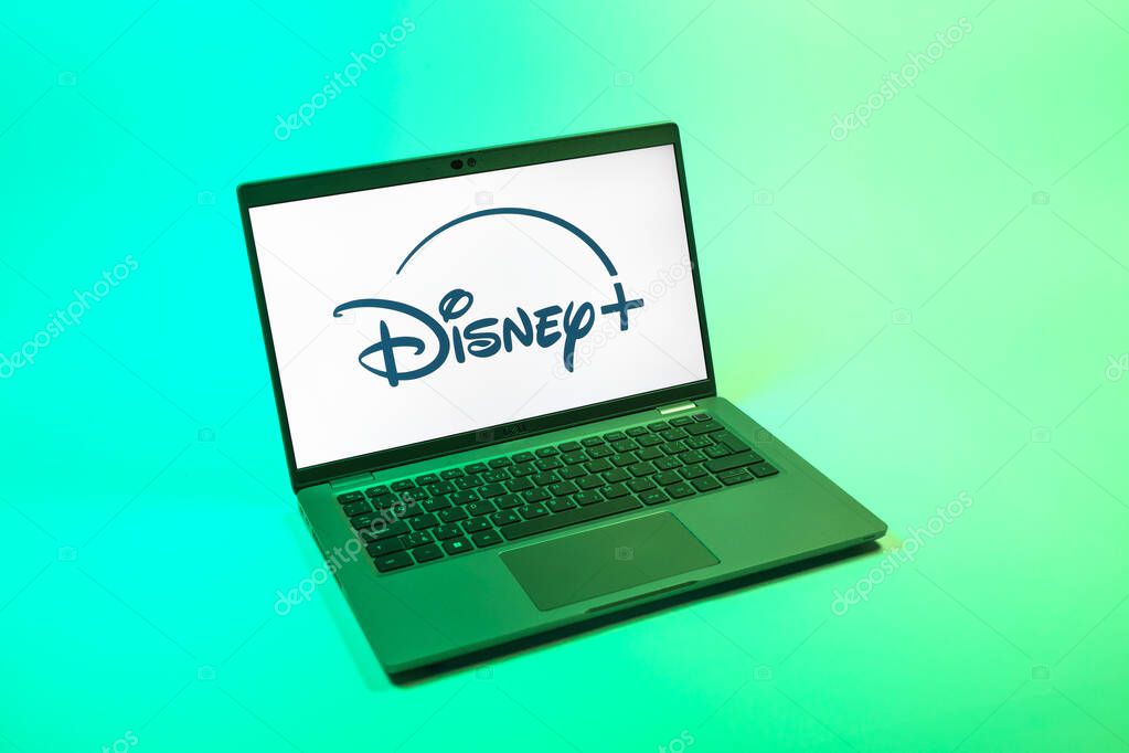 Prague, Czechia - 08 12 2025: A top-down view of a laptop on a uniform background displaying the Disney+ logo. Disney + is a streaming platform for movies and TV shows.