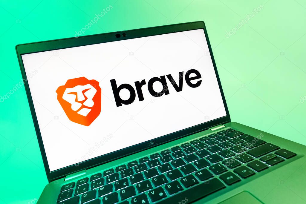 Prague, Czechia - 08 12 2025: A dynamic close-up of a laptop displaying the Brave logo. Brave is a web browser focused on privacy and speed.