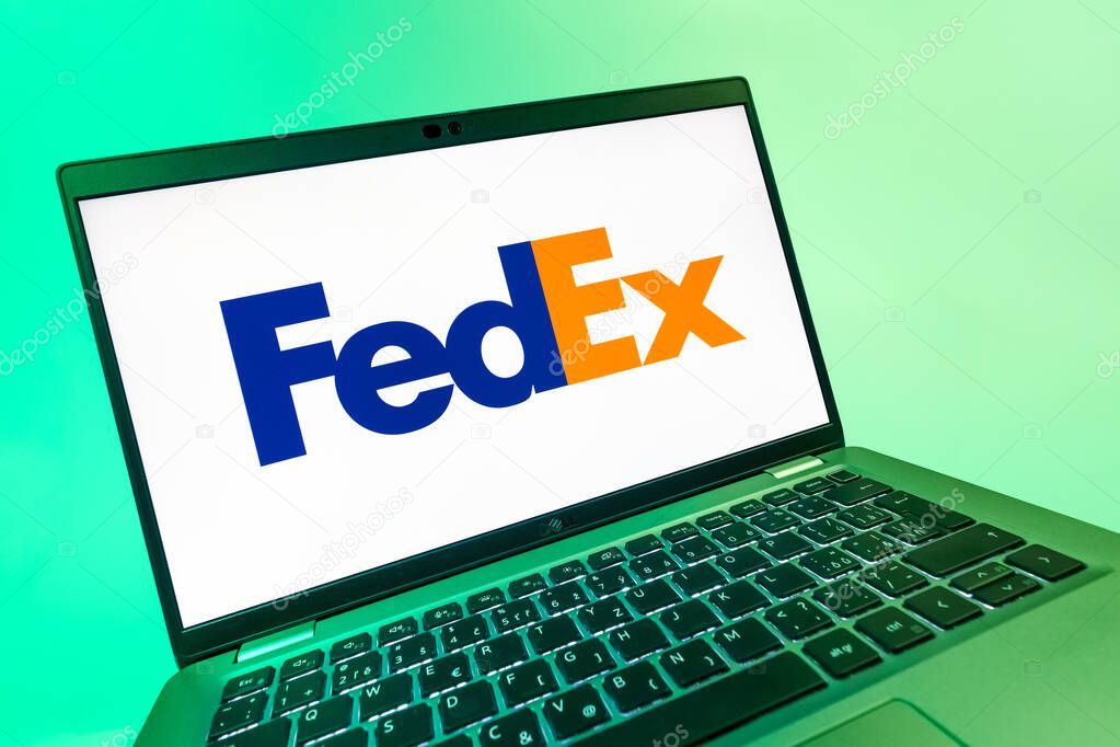 Prague, Czechia - 08 12 2025: A dynamic close-up of a laptop displaying the FedEX logo. FedEX is a logistics company providing shipping and courier services.