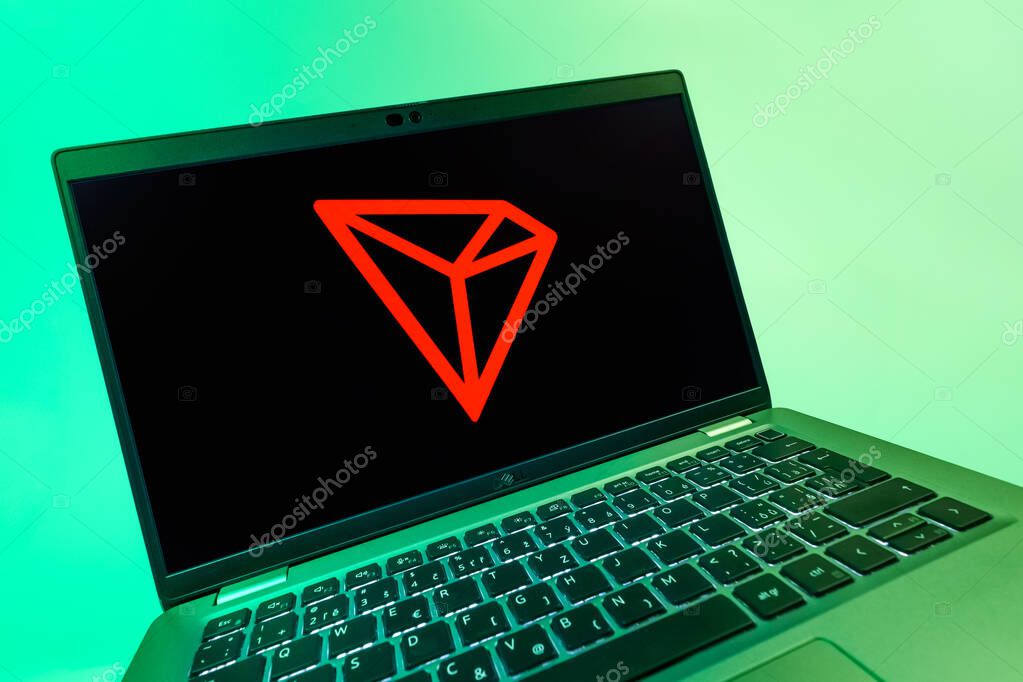 Prague, Czechia - 08 12 2025: A dynamic close-up of a laptop displaying the Tron logo. Tron is a blockchain platform for decentralized applications.