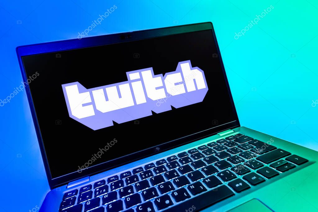 Prague, Czechia - 08 12 2025: A dynamic close-up of a laptop displaying the Twitch logo. Twitch is a platform for live streaming games and content.