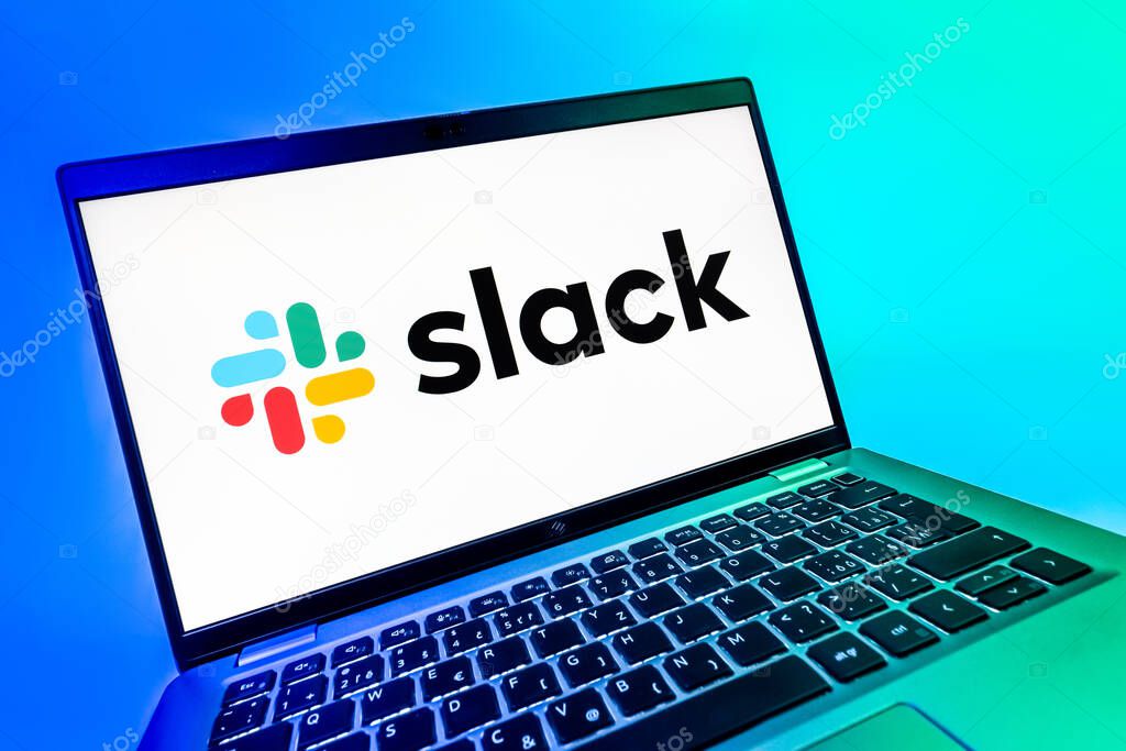 Prague, Czechia - 08 12 2025: A dynamic close-up of a laptop displaying the Slack logo. Slack is a platform for team messaging and workplace communication.