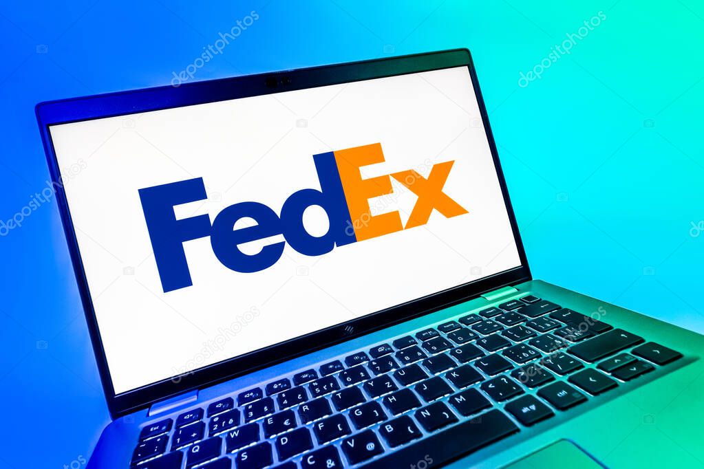 Prague, Czechia - 08 12 2025: A dynamic close-up of a laptop displaying the FedEX logo. FedEX is a logistics company providing shipping and courier services.