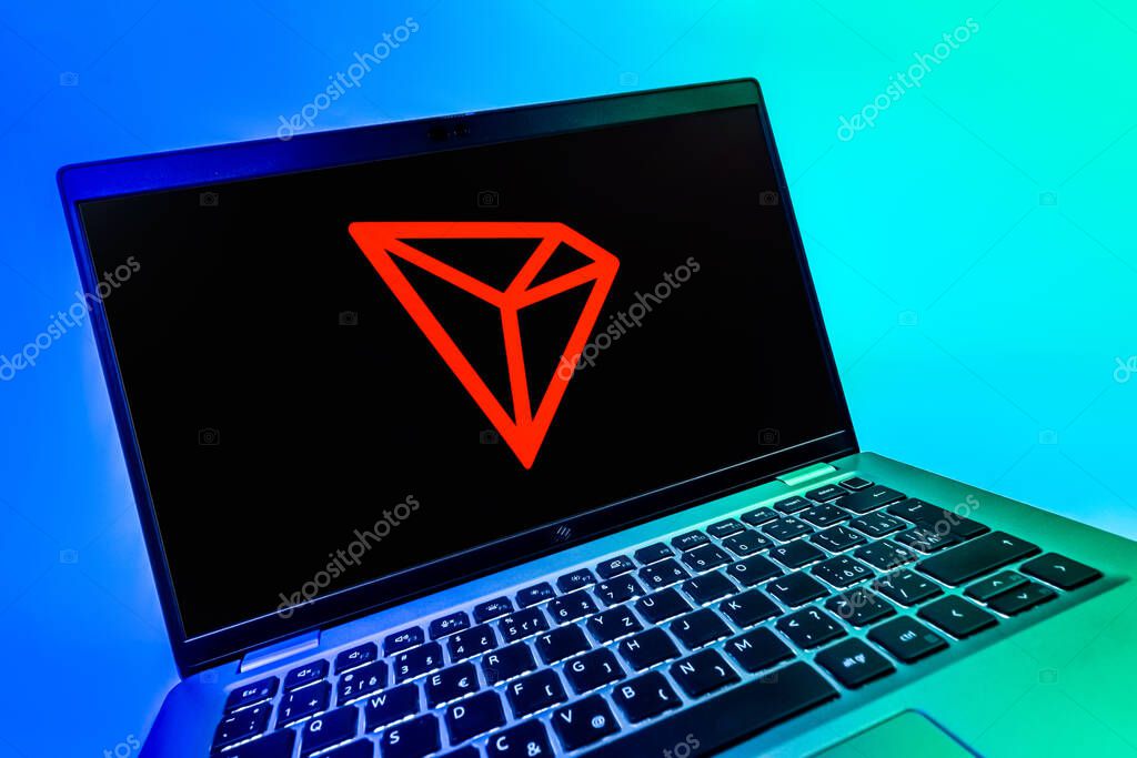 Prague, Czechia - 08 12 2025: A dynamic close-up of a laptop displaying the Tron logo. Tron is a blockchain platform for decentralized applications.