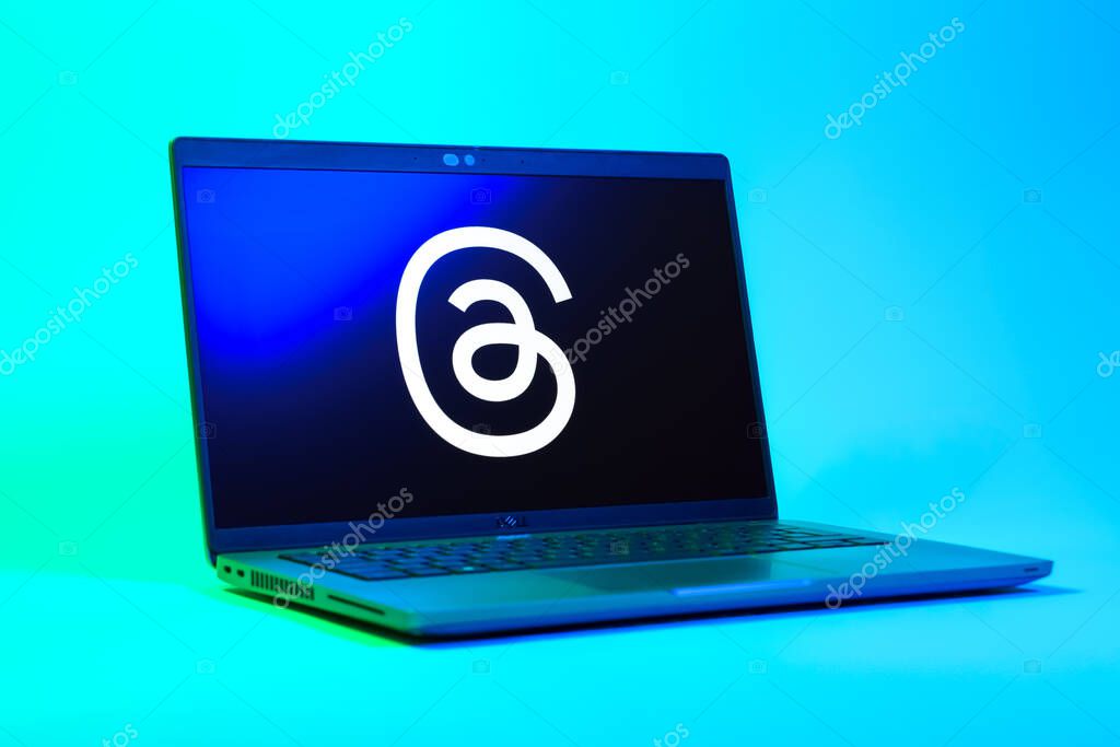 Prague, Czechia - 05 18 2025: A low-angle view of a laptop displaying Threads logo. Threads is a social media platform for sharing short posts and updates.