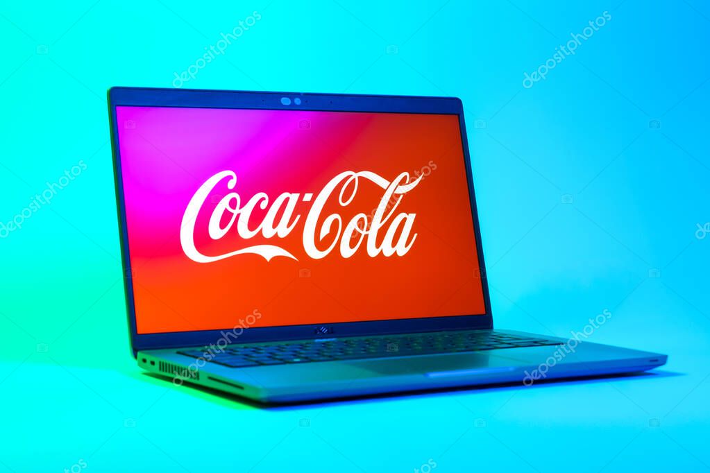 Prague, Czechia - 05 18 2025: A low-angle view of a laptop displaying Coca-Cola logo. Coca-Cola is a beverage company known for its soft drinks.