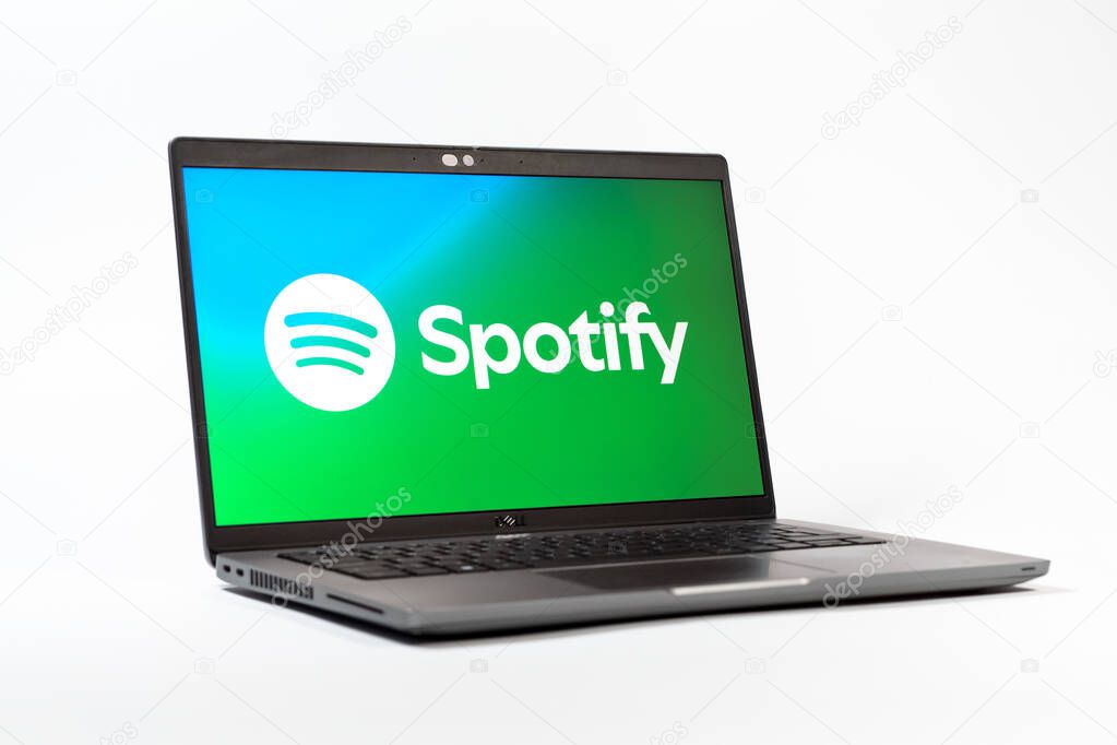 Prague, Czechia - 05 18 2025: A low-angle view of a laptop displaying Spotify logo. Spotify is a platform for streaming and discovering music.