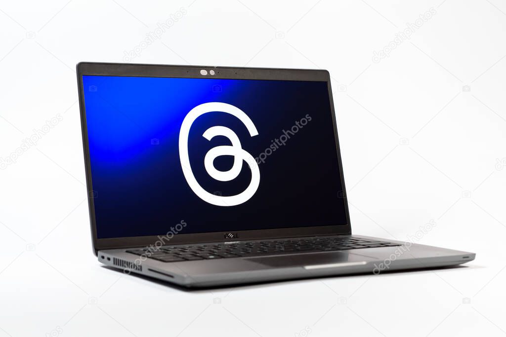 Prague, Czechia - 05 18 2025: A low-angle view of a laptop displaying Threads logo. Threads is a social media platform for sharing short posts and updates.