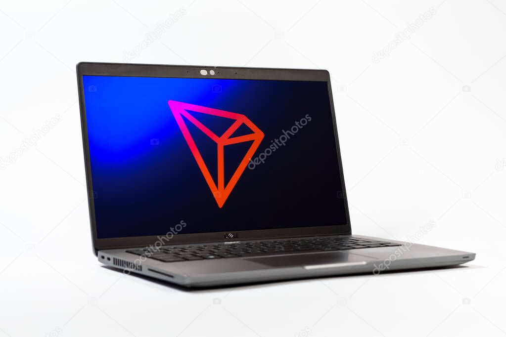 Prague, Czechia - 05 18 2025: A low-angle view of a laptop displaying Tron logo. Tron is a blockchain platform for decentralized applications.