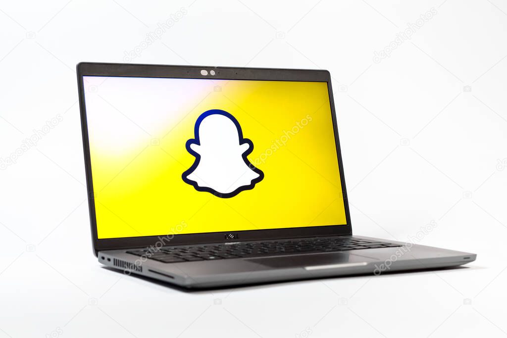 Prague, Czechia - 05 18 2025: A low-angle view of a laptop displaying Snapchat logo. Snapchat is an app for sending photos, videos, and temporary messages.