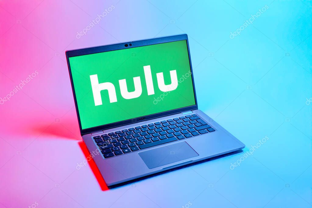 Prague, Czechia - 08 12 2025: A top-down view of a laptop on a uniform background displaying the Hulu logo. Hulu is a streaming platform for TV shows, movies, and live TV.