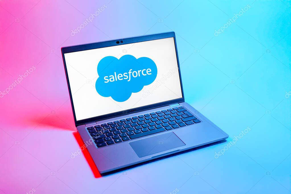 Prague, Czechia - 08 12 2025: A top-down view of a laptop on a uniform background displaying the Salesforce logo. Salesforce is a platform for customer relationship management and cloud services.