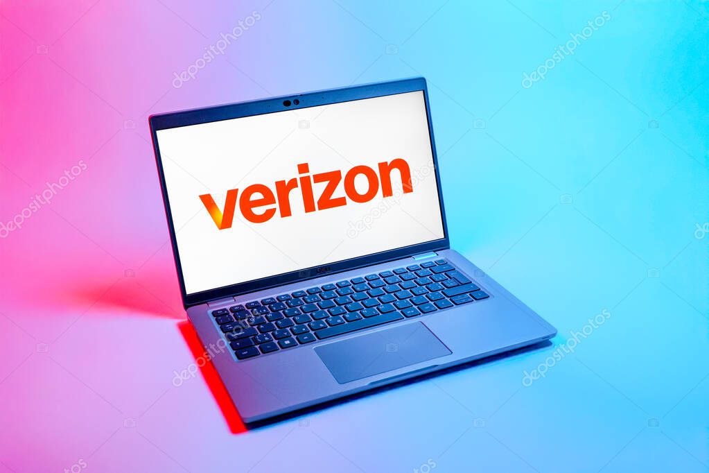 Prague, Czechia - 08 12 2025: A top-down view of a laptop on a uniform background displaying the Verizon logo. Verizon is a telecom company providing wireless and broadband services.