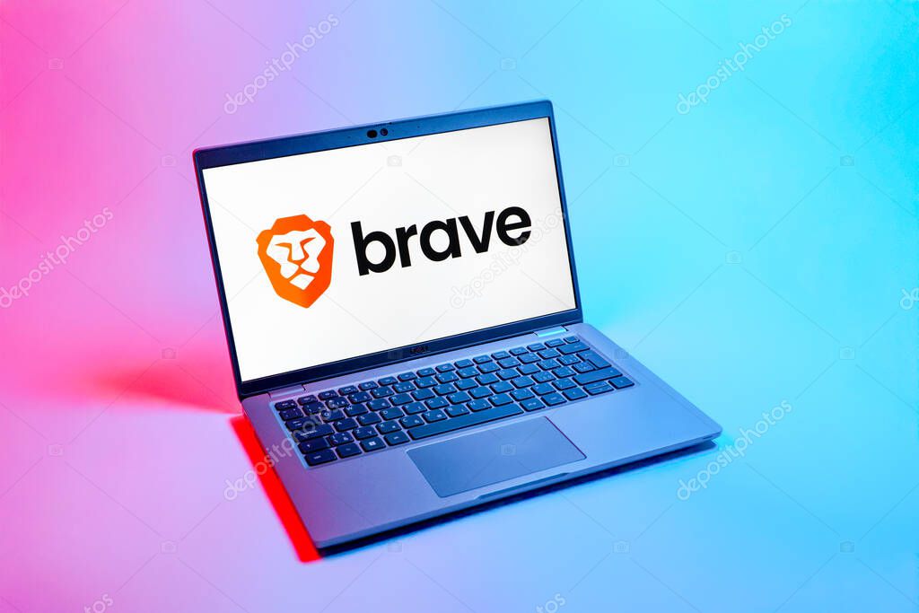 Prague, Czechia - 08 12 2025: A top-down view of a laptop on a uniform background displaying the Brave logo. Brave is a web browser focused on privacy and speed.