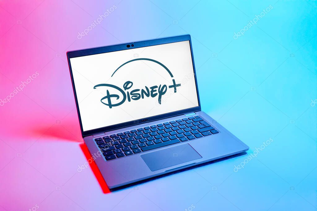 Prague, Czechia - 08 12 2025: A top-down view of a laptop on a uniform background displaying the Disney+ logo. Disney + is a streaming platform for movies and TV shows.