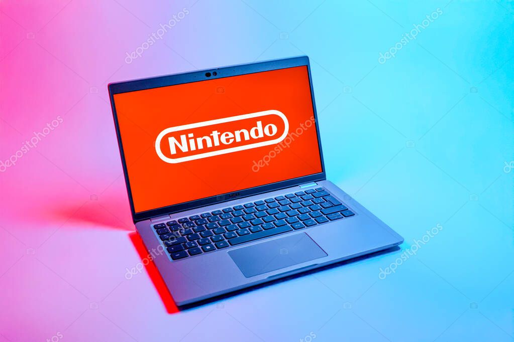 Prague, Czechia - 08 12 2025: A top-down view of a laptop on a uniform background displaying the Nintendo logo. Nintendo is a company producing video game consoles and games.