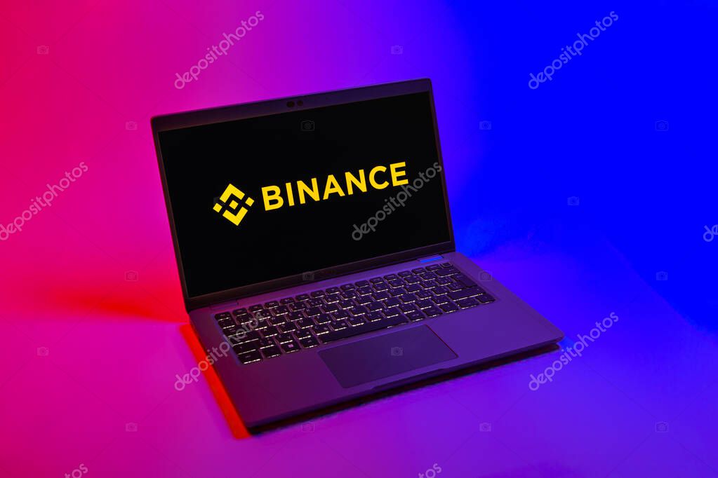 Prague, Czechia - 08 12 2025: A top-down view of a laptop on a uniform background displaying the Binance logo. Binance is a cryptocurrency exchange for trading digital assets.