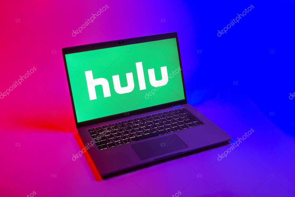 Prague, Czechia - 08 12 2025: A top-down view of a laptop on a uniform background displaying the Hulu logo. Hulu is a streaming platform for TV shows, movies, and live TV.