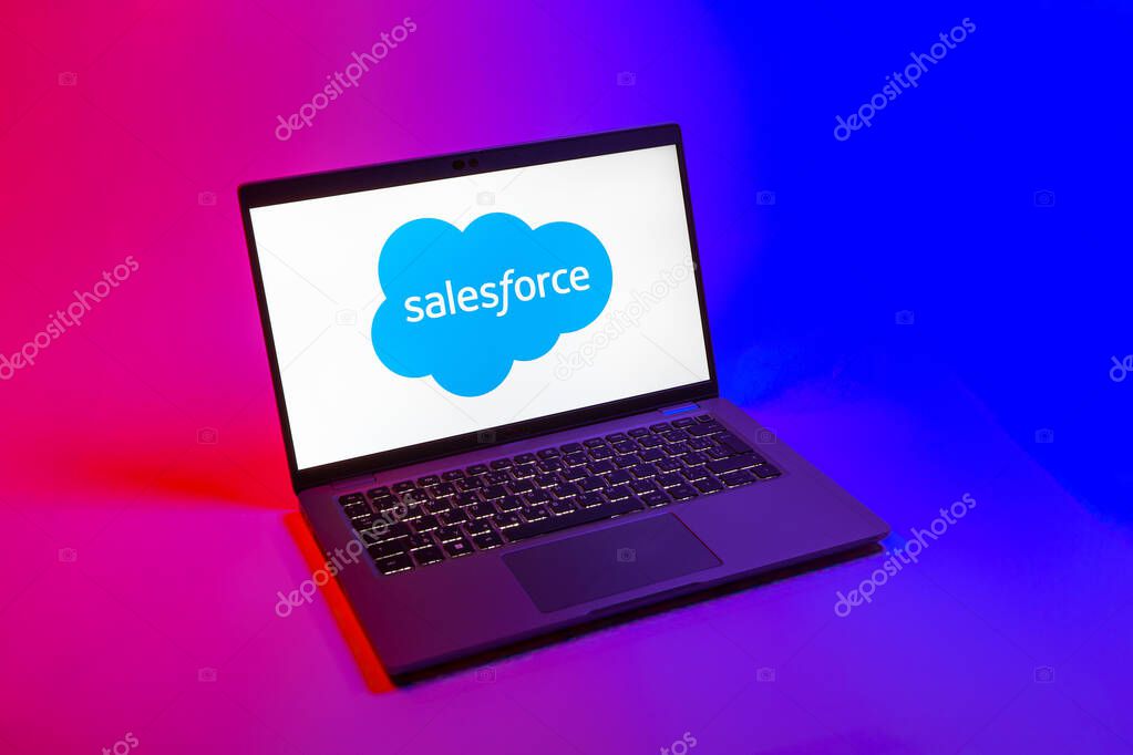 Prague, Czechia - 08 12 2025: A top-down view of a laptop on a uniform background displaying the Salesforce logo. Salesforce is a platform for customer relationship management and cloud services.