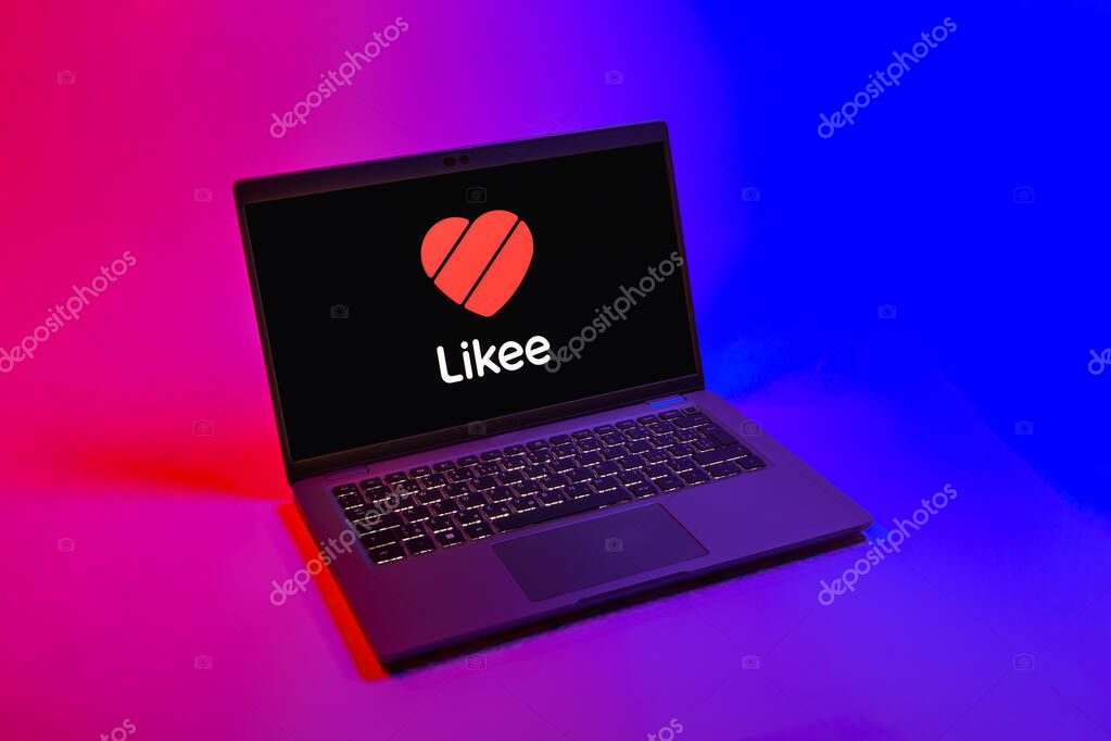 Prague, Czechia - 08 12 2025: A top-down view of a laptop on a uniform background displaying the Likee logo. Likee is a platform for creating and sharing short videos.