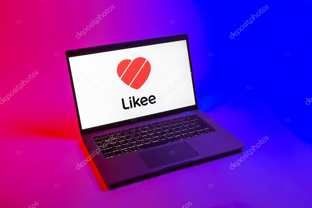 Prague, Czechia - 08 12 2025: A top-down view of a laptop on a uniform background displaying the Likee logo. Likee is a platform for creating and sharing short videos.