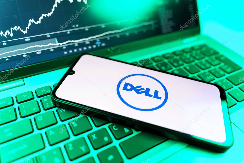 Prague, Czechia - 09 02 2025: Phone on laptop with stock chart showing Dell logo. Dell is a technology company producing computers and IT solutions.