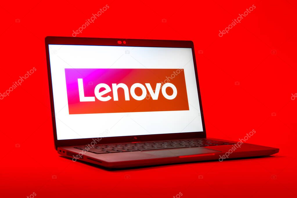 Prague, Czechia - 05 18 2025: A low-angle view of a laptop displaying Lenovo logo. Lenovo is a technology company producing computers and electronics.