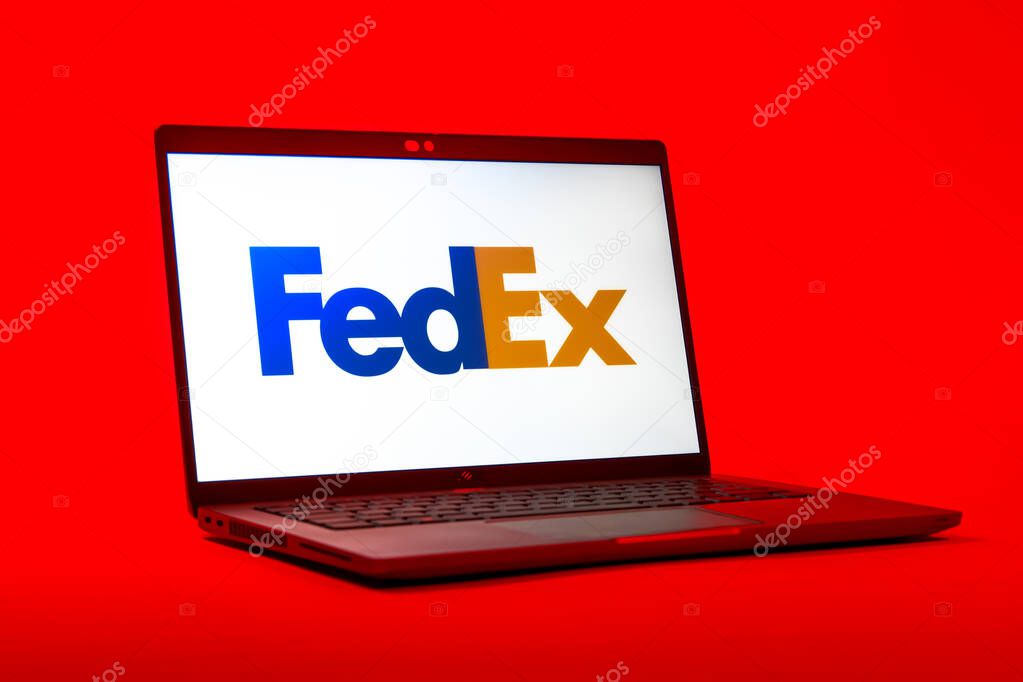 Prague, Czechia - 05 18 2025: A low-angle view of a laptop displaying FedEX logo. FedEX is a logistics company providing shipping and courier services.