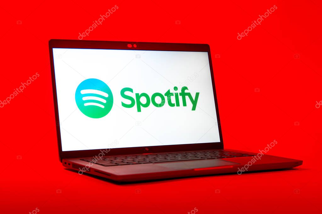 Prague, Czechia - 05 18 2025: A low-angle view of a laptop displaying Spotify logo. Spotify is a platform for streaming and discovering music.