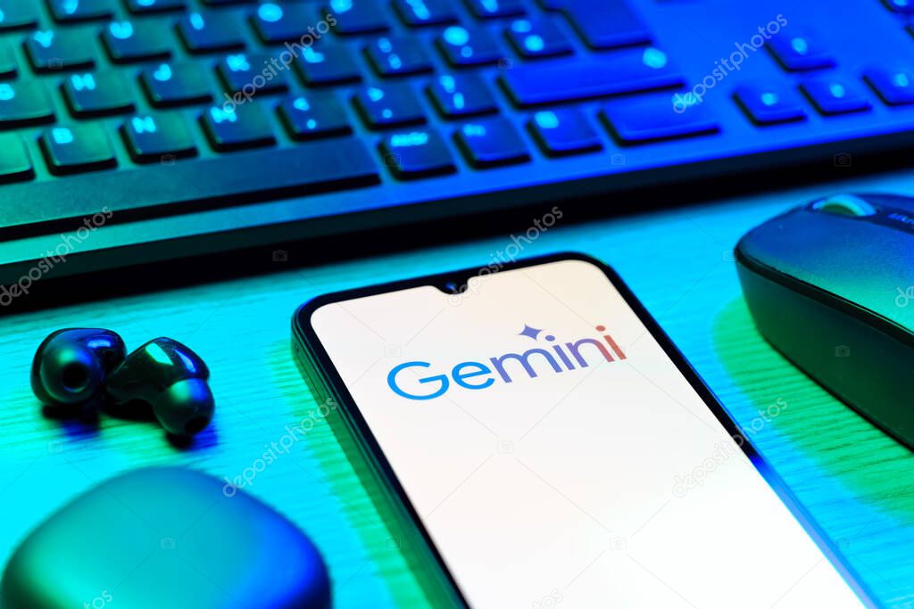 Prague, Czechia - 08 12 2025: A side view of a desk with a keyboard and a mobile phone displaying the Gemini logo. Gemini is a platform for cryptocurrency trading and management.