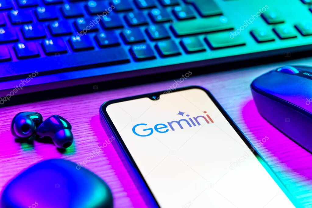 Prague, Czechia - 08 12 2025: A side view of a desk with a keyboard and a mobile phone displaying the Gemini logo. Gemini is a platform for cryptocurrency trading and management.