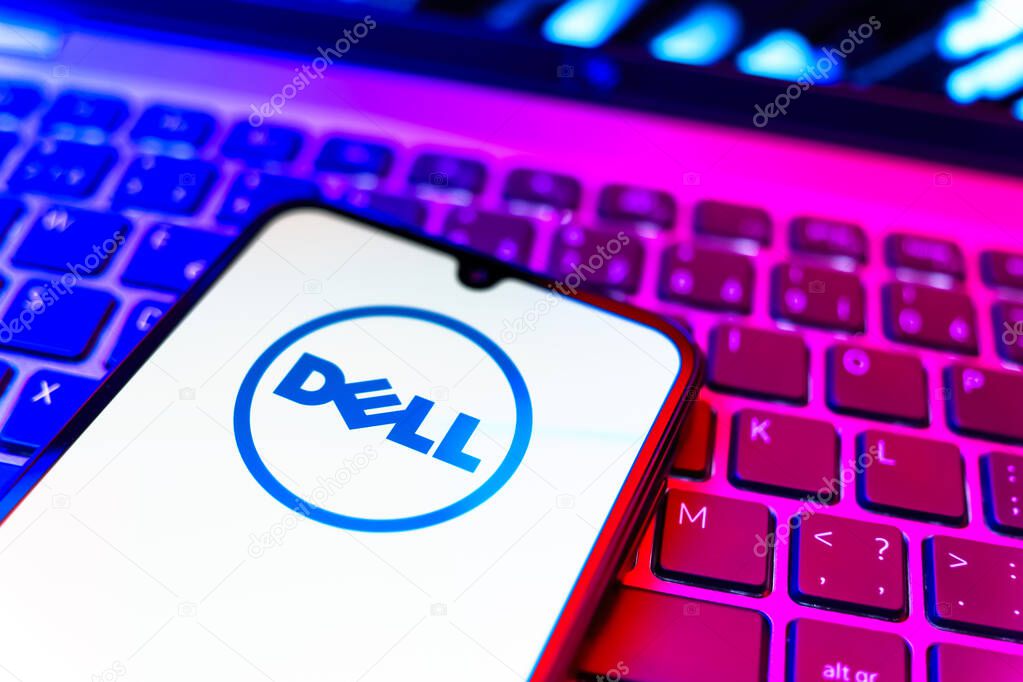Prague, Czechia - 08 19 2025: A close-up view of a mobile phone lying on a keyboard, displaying Dell logo. Dell is a technology company producing computers and IT solutions.