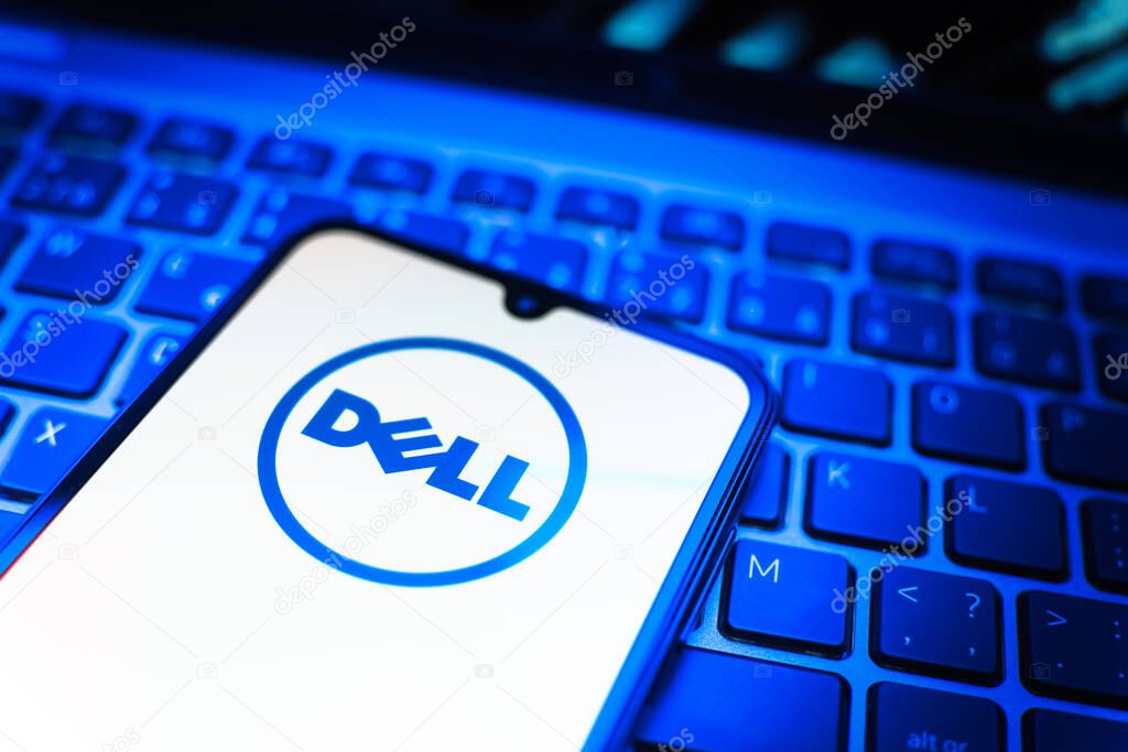 Prague, Czechia - 08 19 2025: A close-up view of a mobile phone lying on a keyboard, displaying Dell logo. Dell is a technology company producing computers and IT solutions.