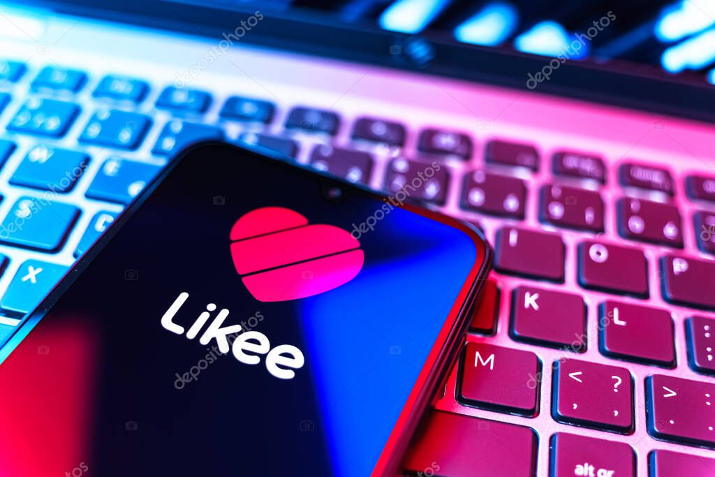Prague, Czechia - 08 19 2025: A close-up view of a mobile phone lying on a keyboard, displaying Likee logo. Likee is a platform for creating and sharing short videos.