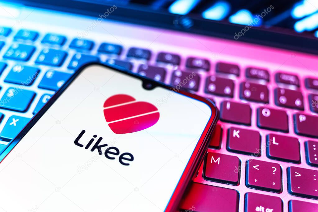 Prague, Czechia - 08 19 2025: A close-up view of a mobile phone lying on a keyboard, displaying Likee logo. Likee is a platform for creating and sharing short videos.
