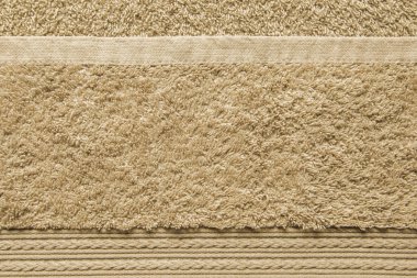 Bej Bathtowel unsuru. Örgülü Pigtails ile yumuşacık dekoratif unsur. Banyo aksesuar arka plan