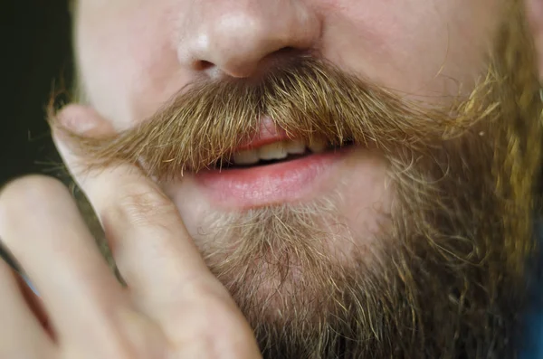 Smiling Bearded Man Blue Denim Shirt Twists Mustache His Hand —  Fotos de Stock