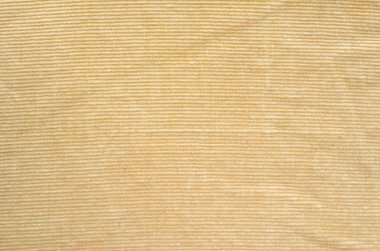 Doku bej kadife elbise. Arka plan olarak kadife tekstil kumaş